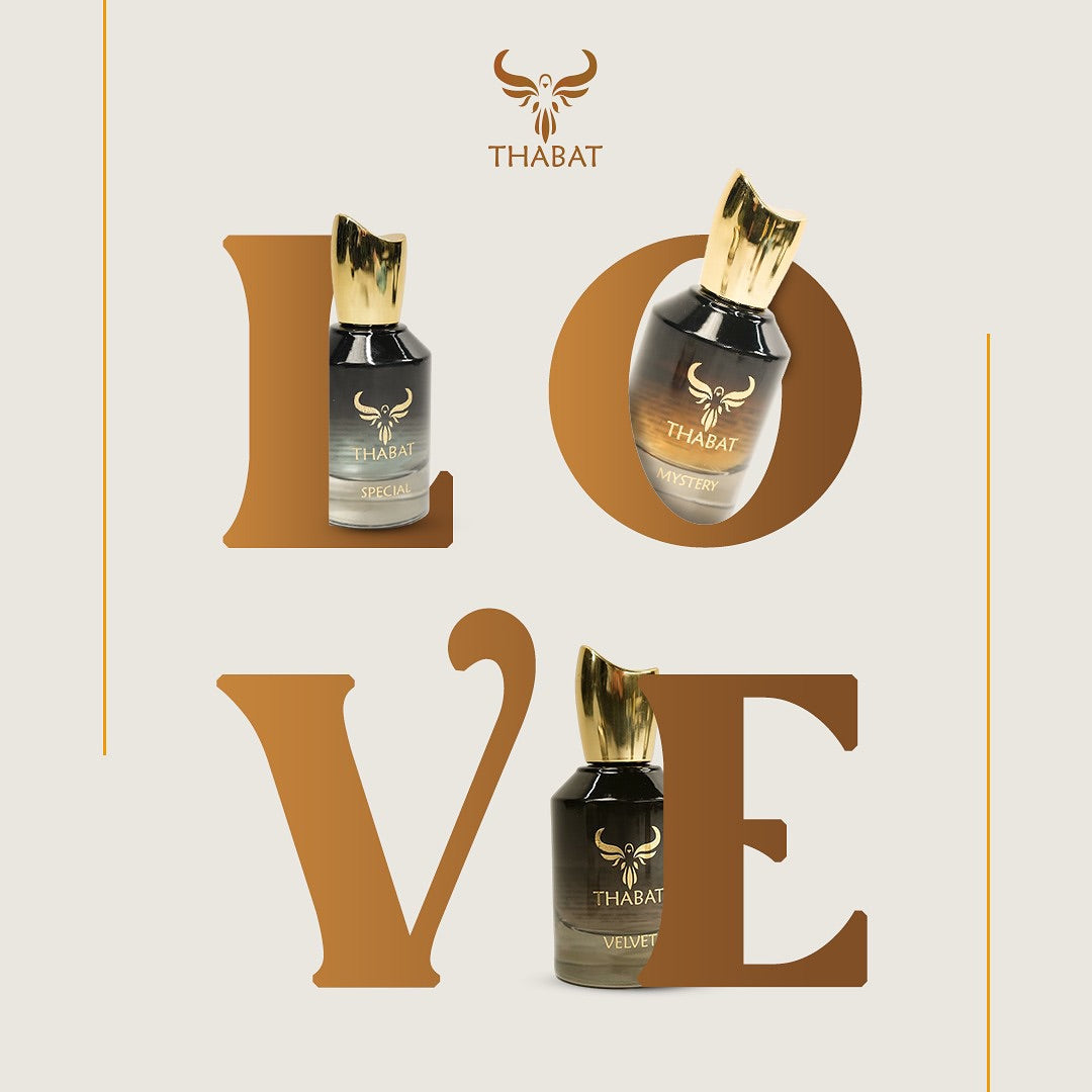 THABAT perfume bottles with decorative 'LOVE' text on a light background